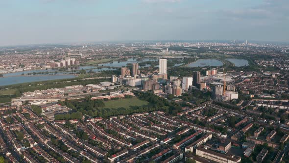 Dolly forward drone shot towards Tottenham hale railway station golden hour