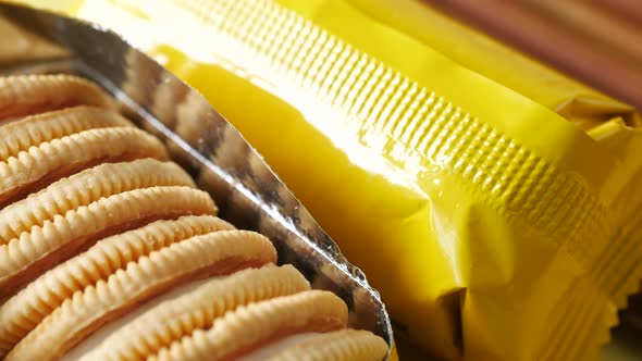 Close Up of Cheese Cookies in a Yellow Packer on Table