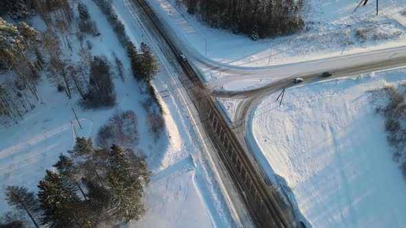 Drone aerial view to winter road in Estonia