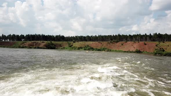 aerial view of kayakers on the Nile river playing in Jinja, Uganda. Nalubale Rafting