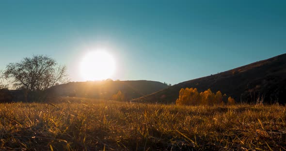 Mountain Meadow Timelapse at the Summer or Autumn Sunset Time