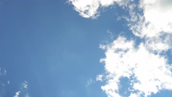 Rotating and Twisting Top View of Picturesque Clouds and Sky