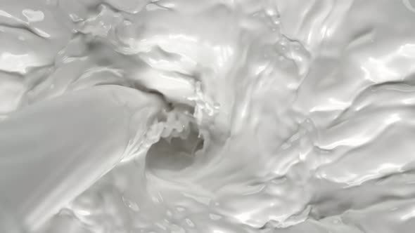 Super Slow Motion Shot of Pouring Milk Into Fresh Cream Vortex at 1000 Fps