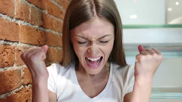 Positive Winning Woman Celebrating Success News at Home