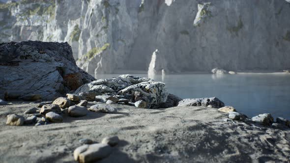 Sand Beach Among Rocks at Atlantic Ocean Coast in Portugal