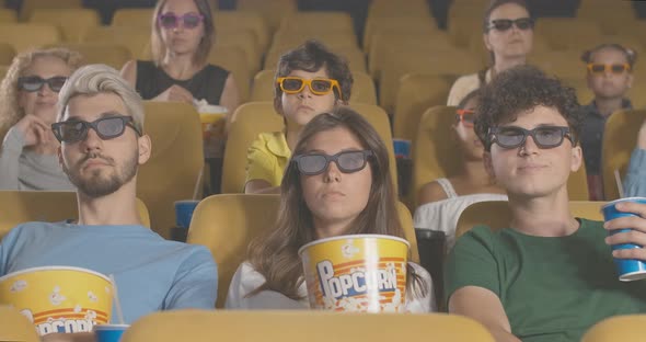 Absorbed People Watching Film in Cinema. Portrait of Men and Women of Different Ethnicities Enjoying