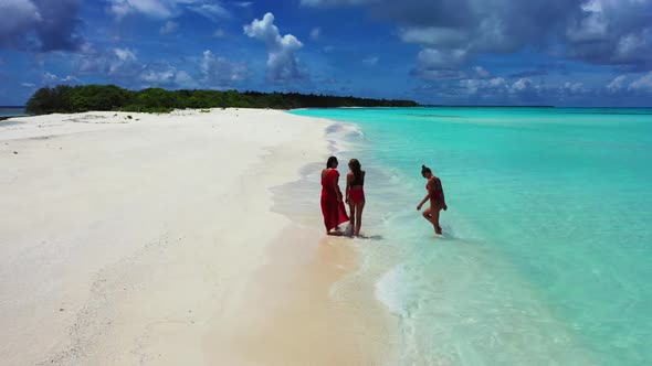 Tourists happy together on relaxing coastline beach journey by transparent ocean with clean sand bac