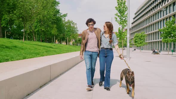 Couple with dog walking in the city