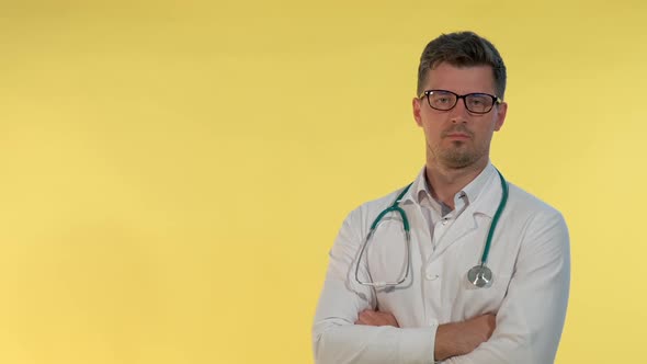 Portrait of Young Doctor in Lab Coat Denying Something to the Camera