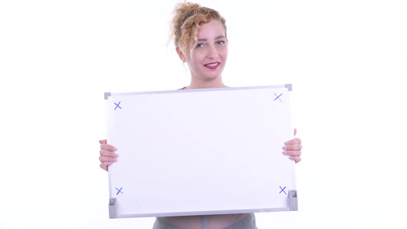 Happy Beautiful Blonde Woman Holding White Board