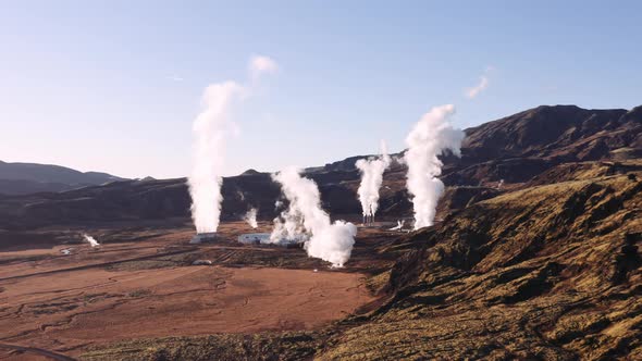 Drone Of Plumes Of Hot Steam Rising Into Blue Sky