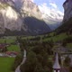 Fly up a drone in the valley of lauterbrunnen passing a little church. At the end there is a reveal - VideoHive Item for Sale