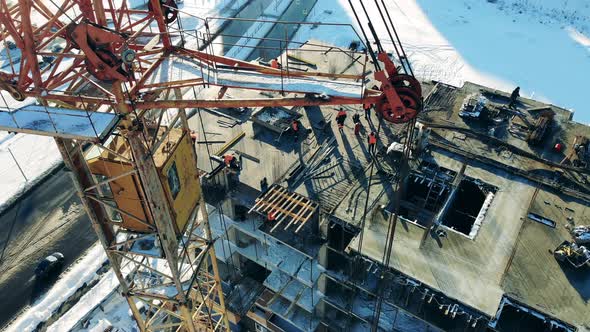 Multistory Construction Yard and a Building Crane Next To It