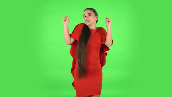 Pretty Young Woman Is Dancing Funny. Green Screen