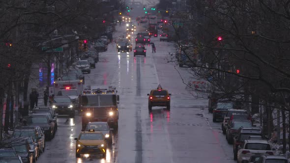 Slow-motion of New York traffic with Fire Truck and Ambulance on a wet Manhattan main street.