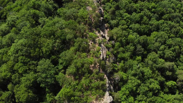 Flying over the stones and forest in Caucasus.