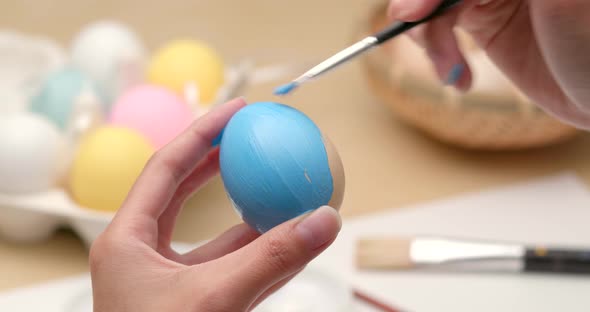 Painting on egg for Easter holiday