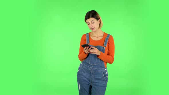 Girl Angrily Texting on Her Phone. Green Screen