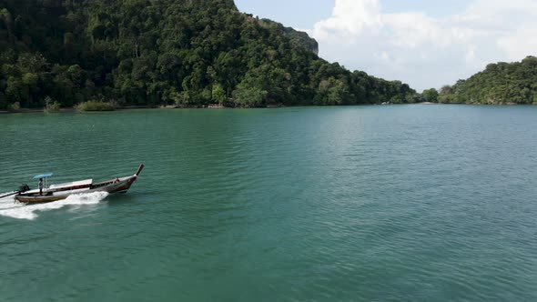 Thai Traditional Longtailed Hopping Tour Motorboat Traveling Along the Railay Peninsular on Sunny