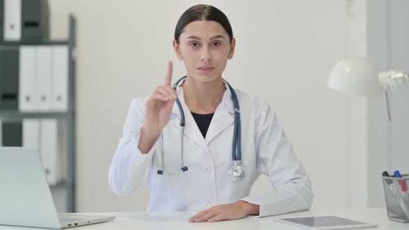 Denying Female Doctor Waving Finger As No