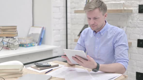 Businessman Using Tablet