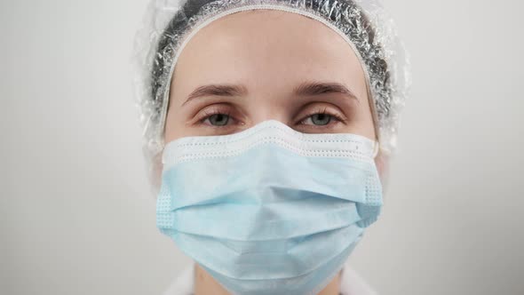 Young Woman Patient Wearing Disposable Blue Virus Face Mouth Nose Mask Closeup Portrait