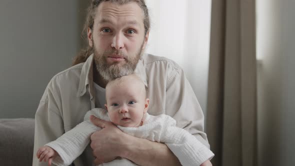 Happy Father Caucasian Middle Aged Bearded Man with Little Daughter Baby Son Newborn Infant Looking