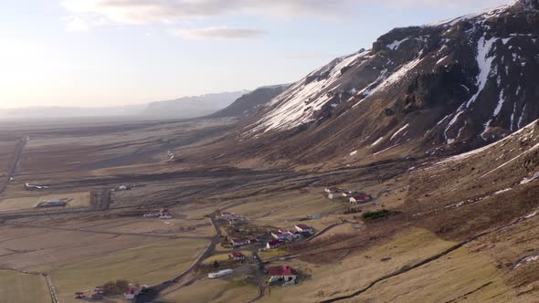 Small Secluded Town Next to a Snowy Mountain in the Winter