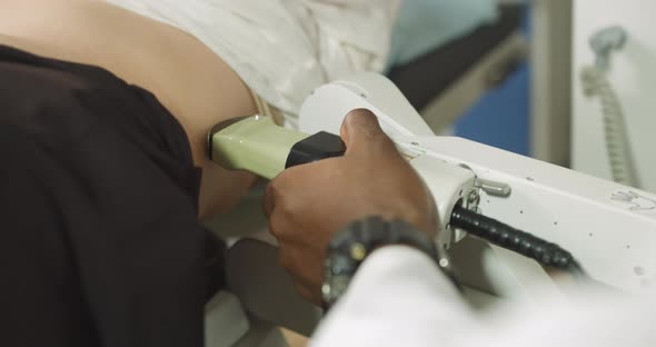 Cropped Shot of Belly of Woman Patient Having Ultrasound to Determine Kidney