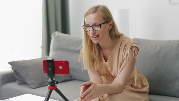 Woman Recording Vlog on Smartphone