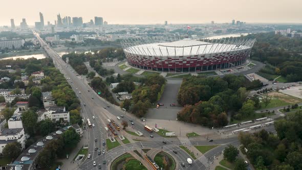 Aerial drone shot of the PGE Narodowy - National Stadium, Warsaw skyline and the Washington Roundabo