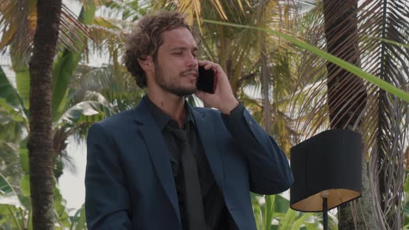 Businessman Having Phone Call In Bali