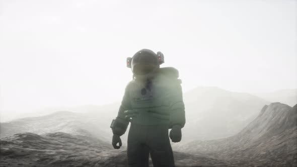 Astronaut on Another Planet with Dust and Fog alt