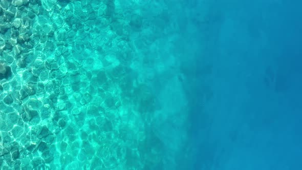 Waves and azure water as a background. View from drone at the sea surface.
