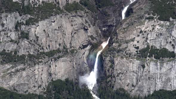 Yosemite falls lower and upper views on sunny day, Tilt up reveal shot