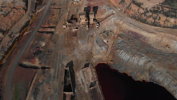 The destroyed landscape of an abandoned mine from a top-down aerial view.