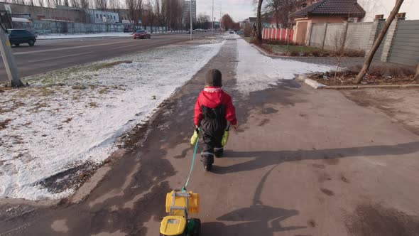 Boy Walking On The Street In Winter Slow Motion