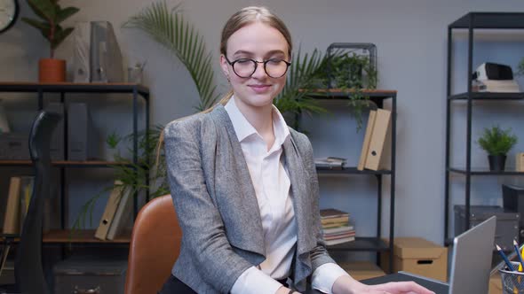 Joyful Business Woman Freelancer Concentrated Developing New Project While Looking on Laptop Screen