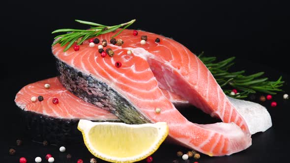 Trout Steaks Rotation Video. Raw Slices with Perfect Texture of Uncooked Red Fish