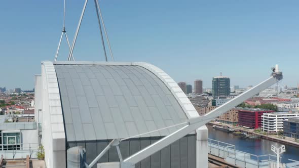 Fly Over Top of Office Buildings Reveal of Historic Oberbaum Bridge with Train Crossing Spree River