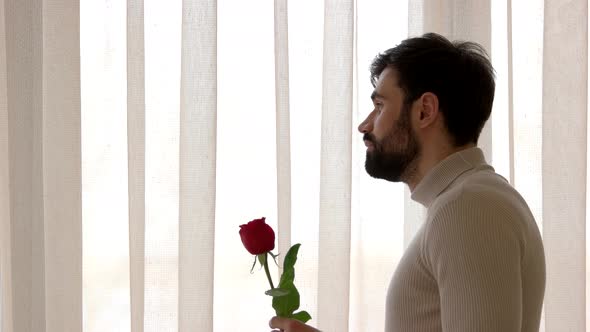 Caucasian Man Holding a Rose