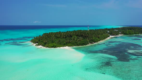 Luxury fly over copy space shot of a white sand paradise beach and blue sea background in colourful 