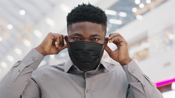 Closeup Young African American Man Wears Protective Medical Mask Observes Precautionary Measures