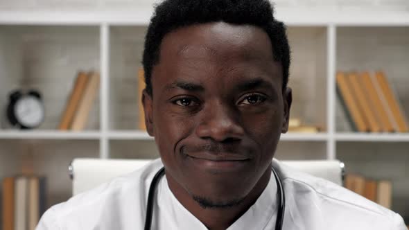 Close Up Smiling Face African American Man Doctor Looking Camera in Hospital