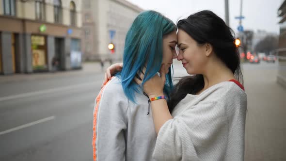 Two Tender Lesbian Women Hugging in Public