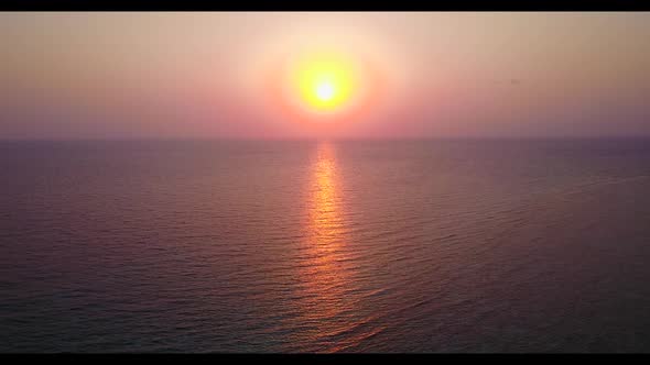 Aerial top view landscape of tranquil coastline beach adventure by shallow water with white sand bac