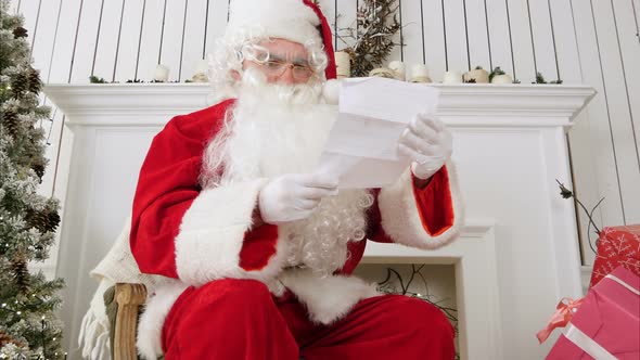 Angry Santa Claus Reading a Letter and Tearing It Apart