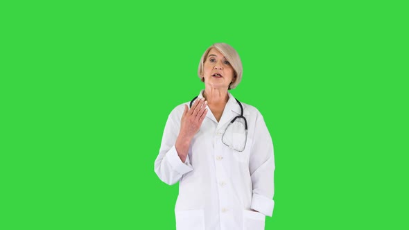 Pleasant Carrying Doctor Lady Talking To Camera on a Green Screen Chroma Key