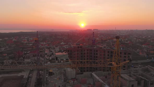 Construction Site in the Middle of the City and Private Houses at Sunset in .