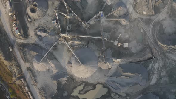 Big Crusher Working with Rubble at a Quarry Moving It on a Line